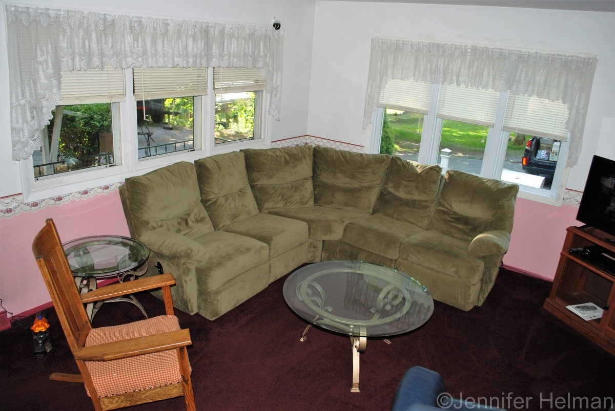 The living room offers plenty of seating  